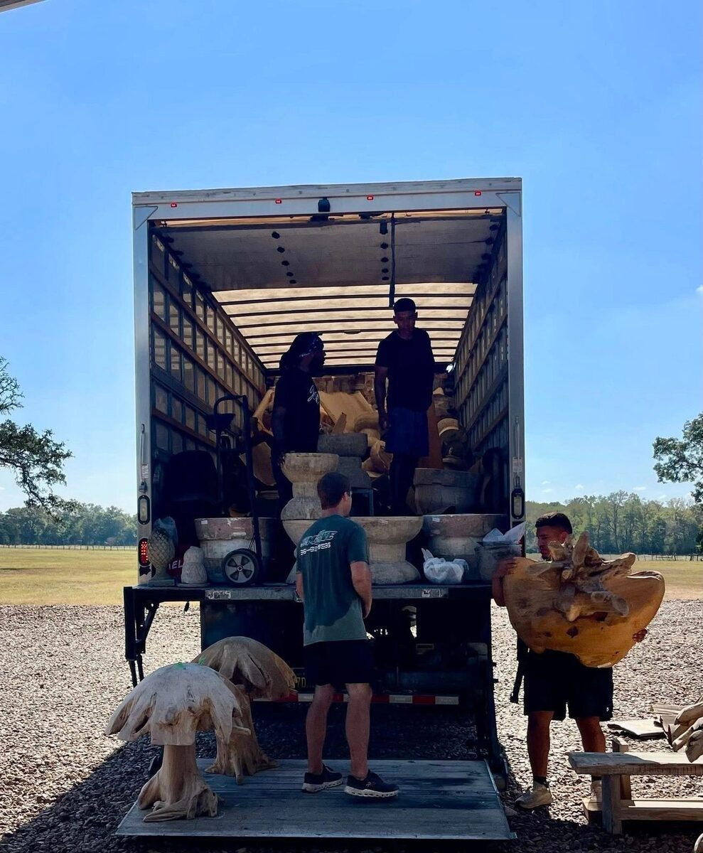 PRO MOVE crew loading stone antiques into the box truck at a Round Top field
