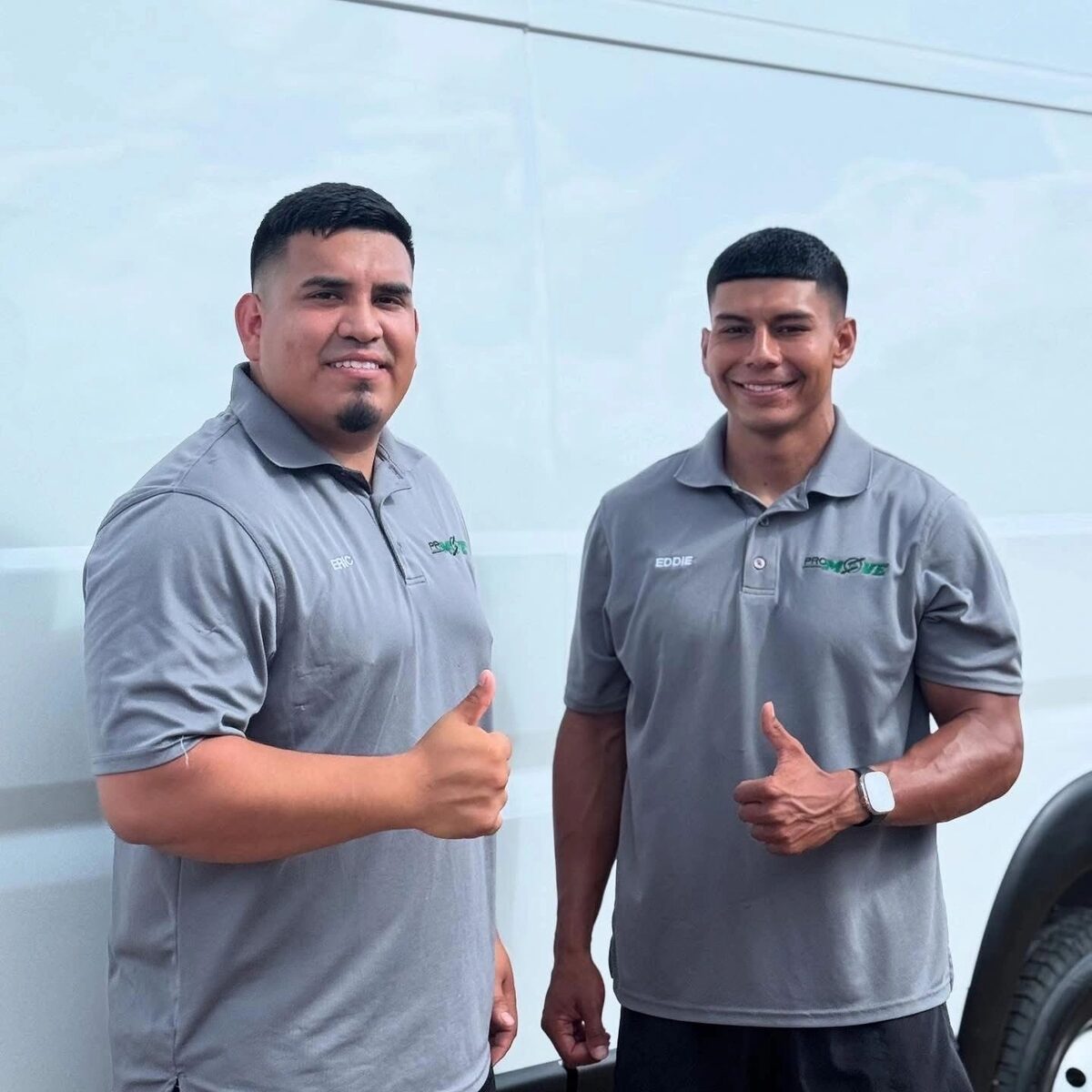 The PRO MOVE crew standing by their branded delivery van in Round Top, Texas