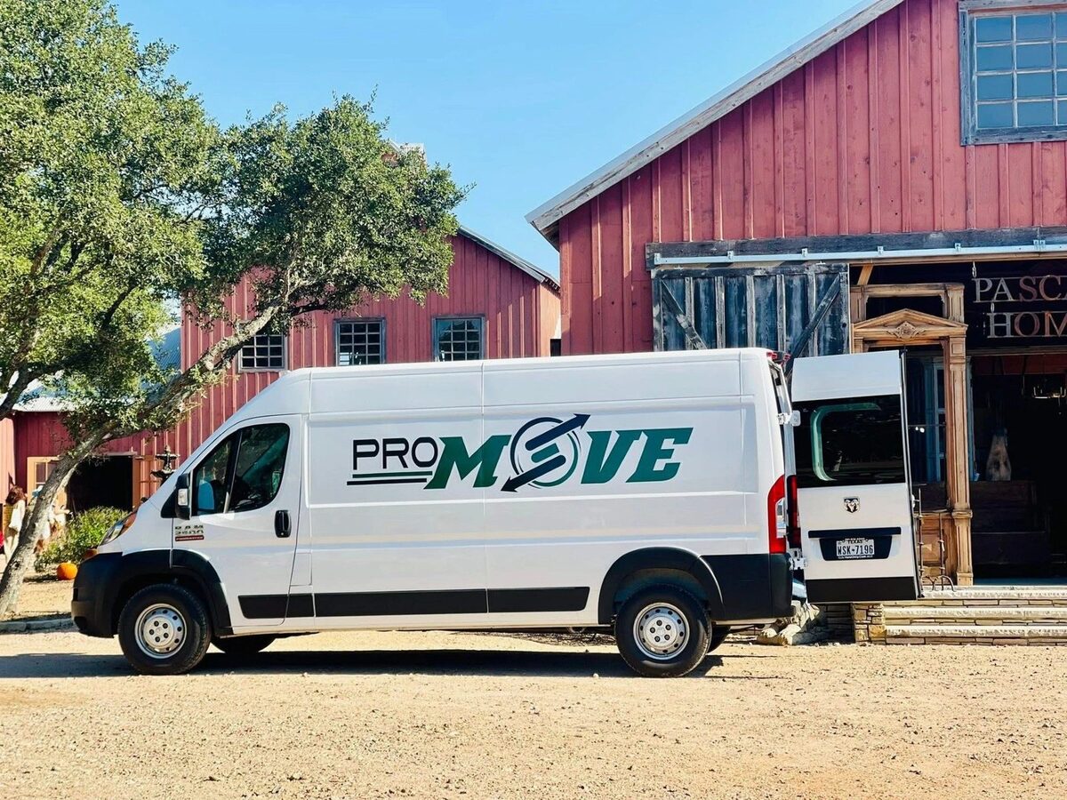 PRO MOVE delivery van parked at a Round Top antique shop for a booth pickup